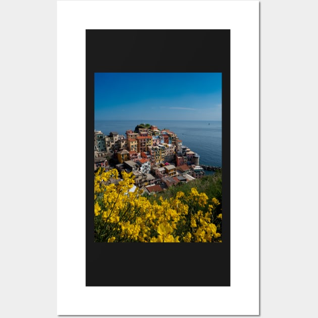 View on the cliff town of Manarola, one of the colorful Cinque Terre on the Italian west coast Wall Art by Dolfilms